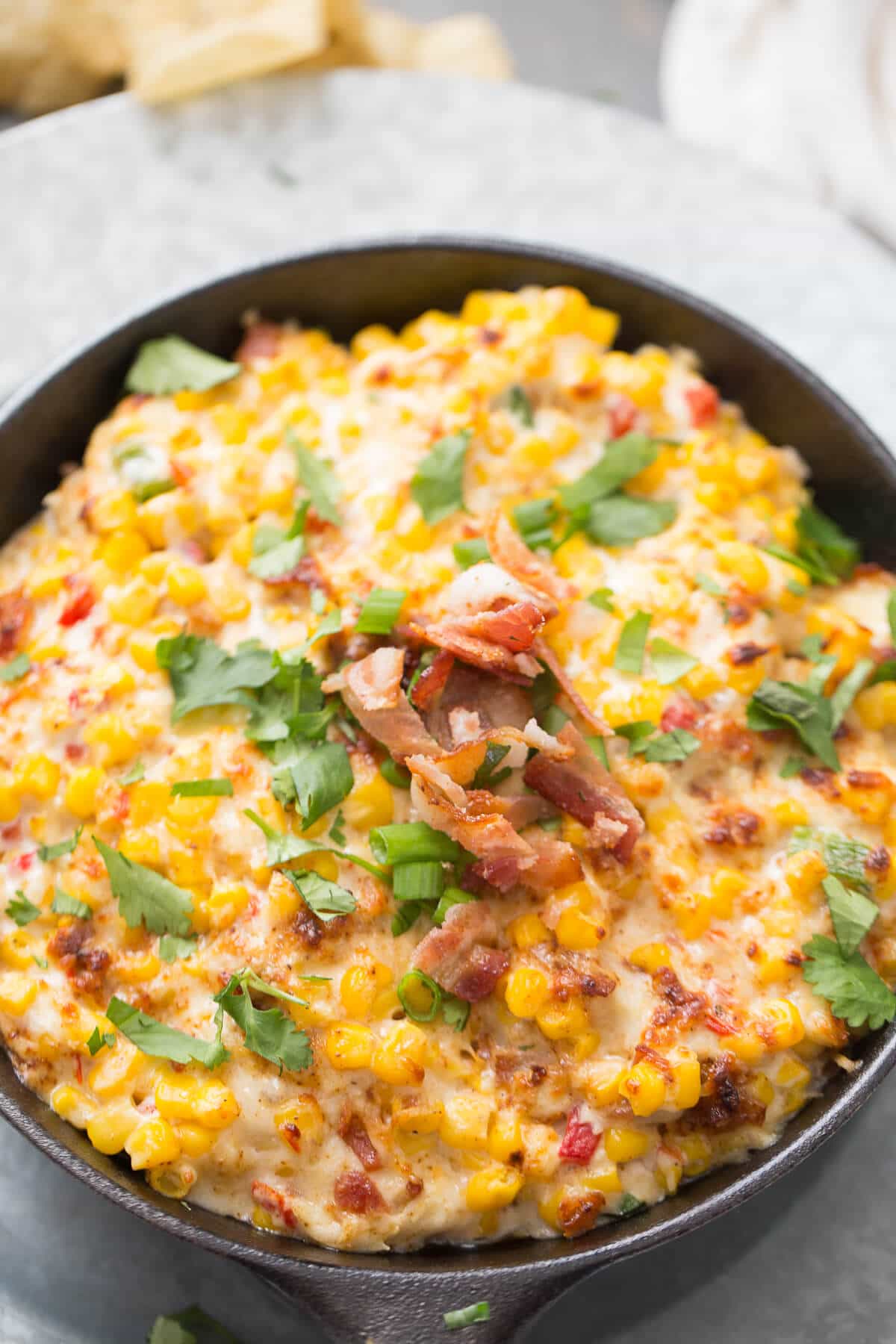 This hot corn dip recipe might be the best thing ever! You can't ever go wrong with hot melted cheese and bacon!