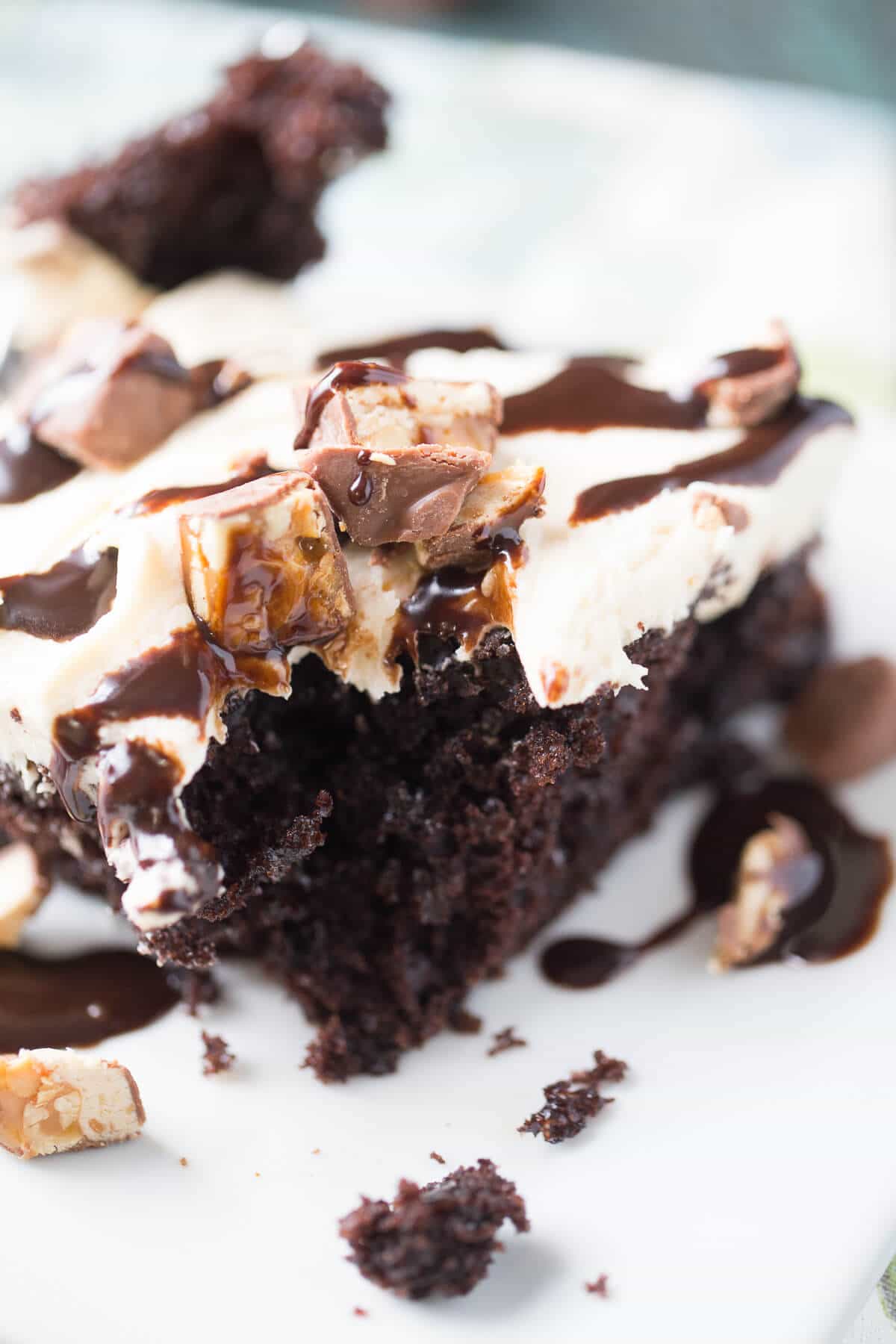 Who could resist a Snickers Poke Cake? This rich tasting dessert is irresistible!