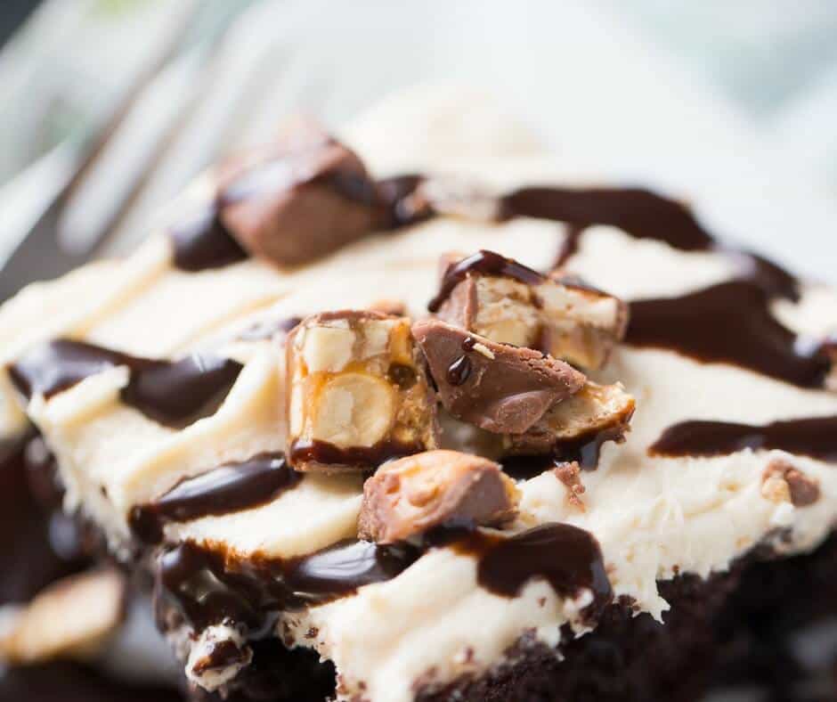A Snickers poke cake is what you need when you need a chocolate fix! Cake, caramel frosting, caramel and chocolate will certainly satisfy your sweet tooth!