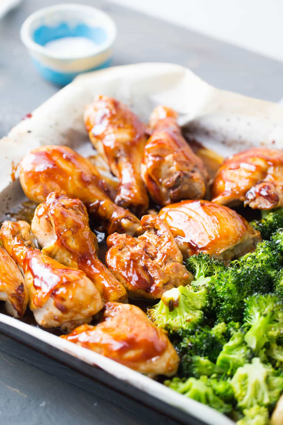 This sheet pan dinner is so simple and so good! The bourbon chicken recipe feature chicken coated with a sticky sweet bourbon glaze and served it with potatoes and broccoli!