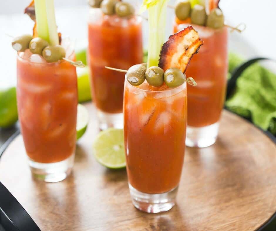 Buffalo sauce makes these Bloody Mary's extra special! Garnish these cocktails with blue cheese stuffed olives and bacon!
