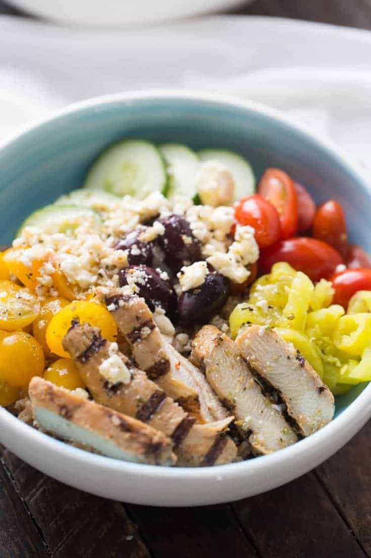 Mediterranean chicken bowl with lots of fresh veggies and healthy farrow! This dish cannot be beat!