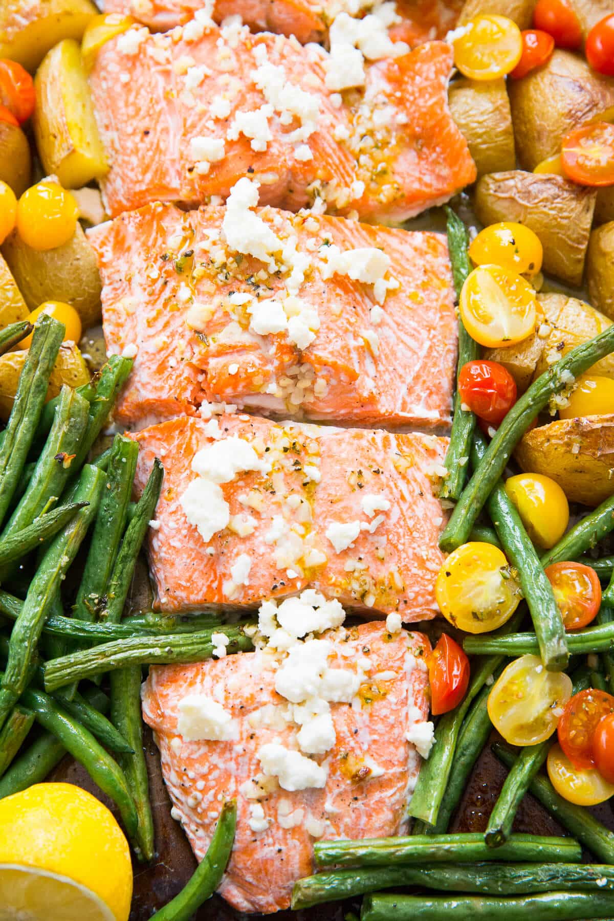This Mediterranean salmon is baked simply with vegetables all in one sheet pan!