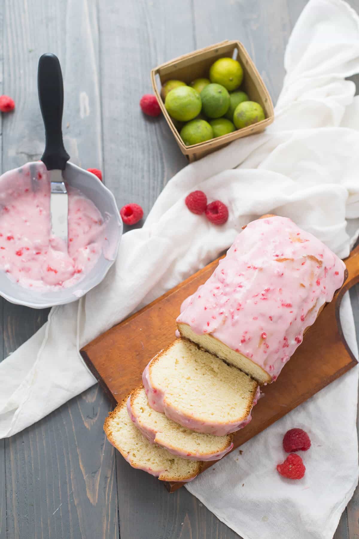This key lime cake is simple but don't let dissuade you! The tangy cake tastes amazing with the homemade raspberry glaze! lemonsforlulu.com