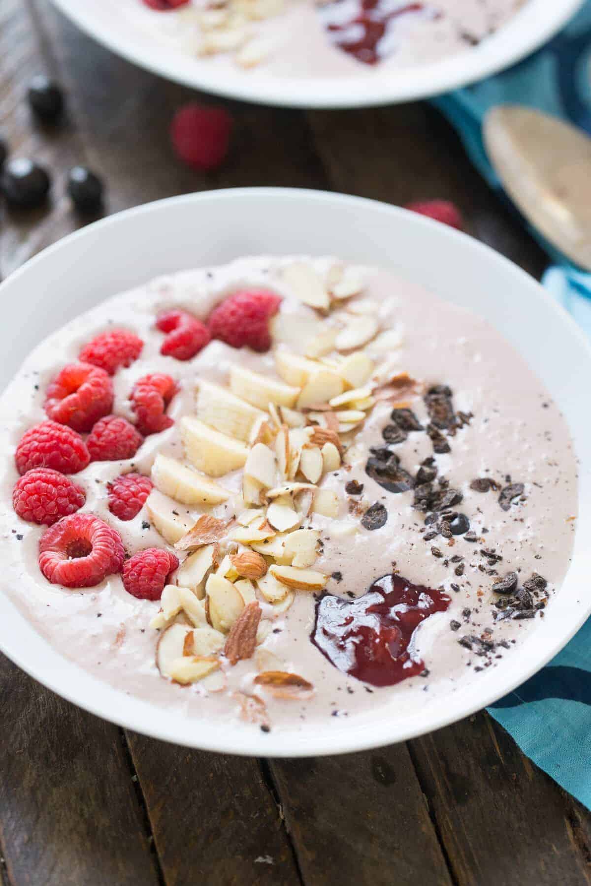 This smoothie bowl has a hint of mocha, strawberry and fresh fruit! The chocolate covered coffee beans make it a stand out! lemonsforlulu.com