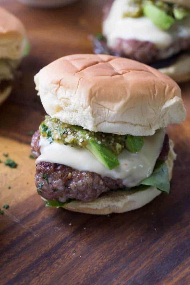 Pork burgers are a great change from the normal beef burger. These burgers have a simple Verde sauce on top!