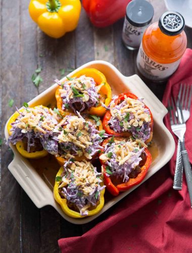 Southwest Stuffed Peppers are filled with brisket and topped with slaw!
