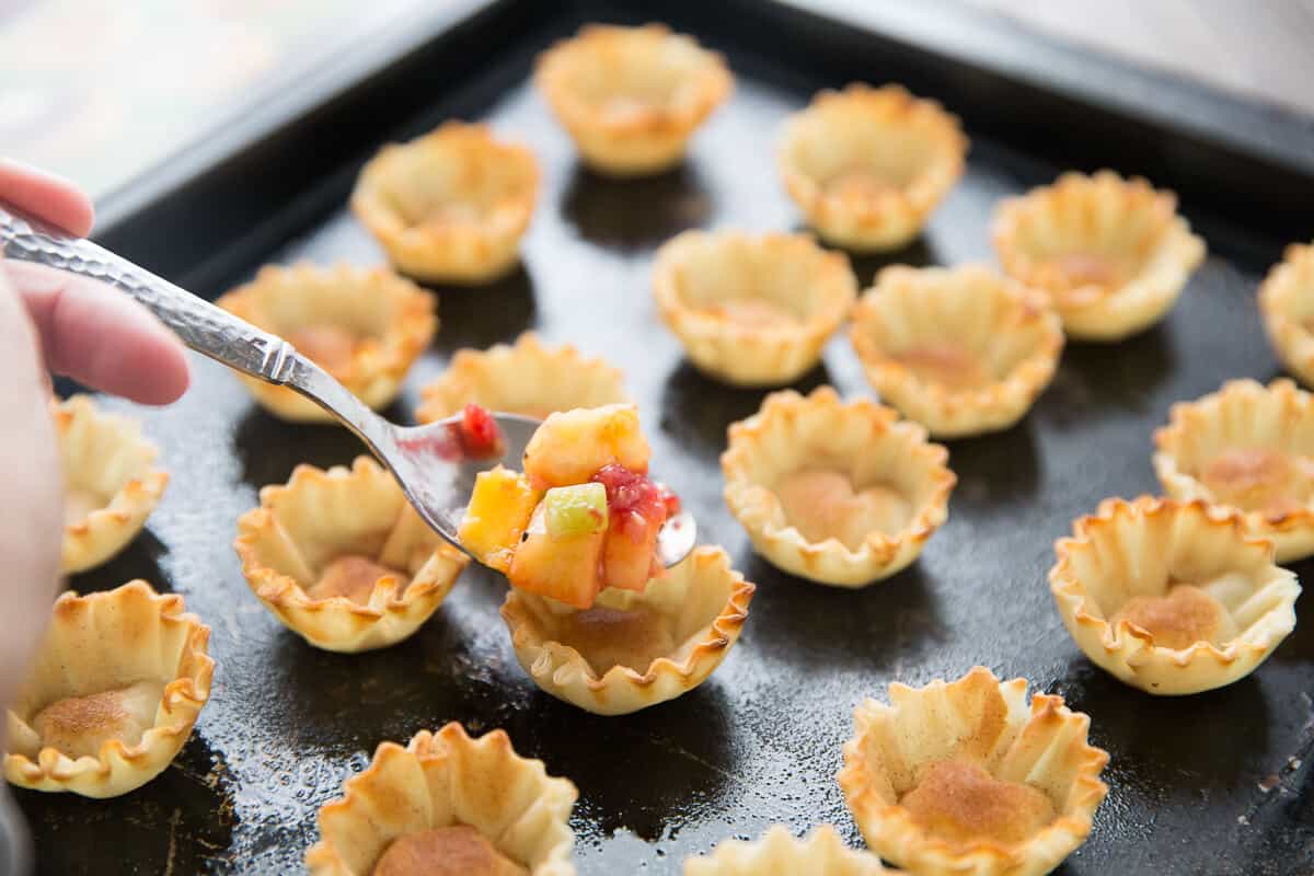 Phyllo cups make short work of fruit salsa. The cinnamon sugar baked shells are the perfect partner to the sweet fruit!