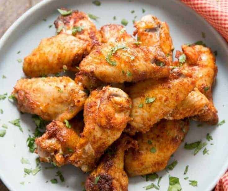 Dry rub chicken wings are like a party in your mouth! The spicy sweet coating is absolutely addictive!