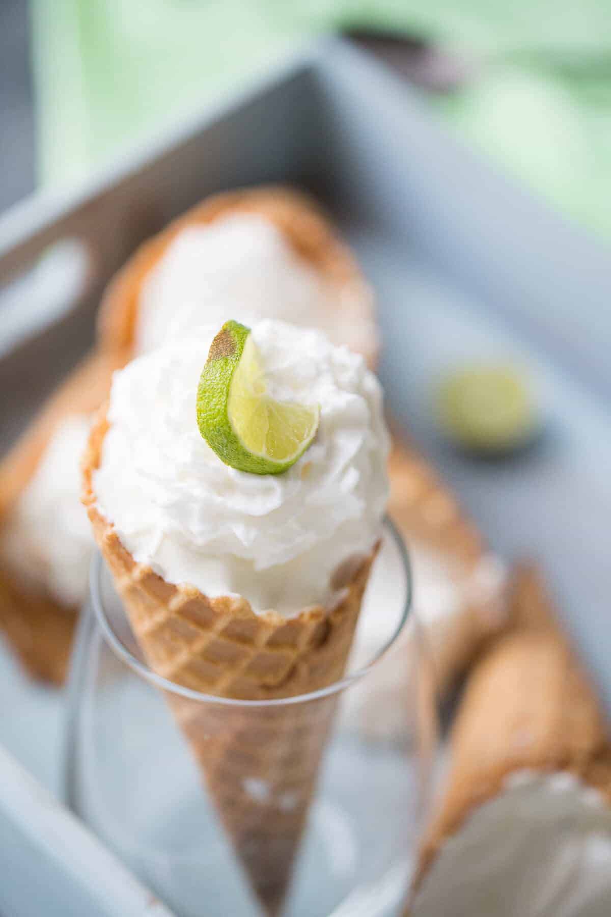 Frozen Key Lime Pie is the perfect summer time treat! The waffle cone makes it fun to eat!