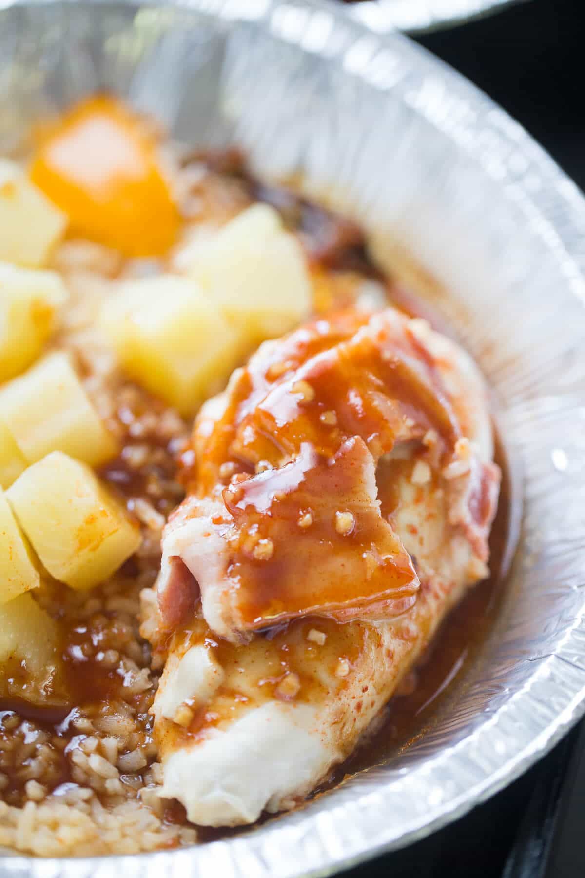 Pineapple chicken is coated in a rich, succulent sauce and cooked right on the grill!