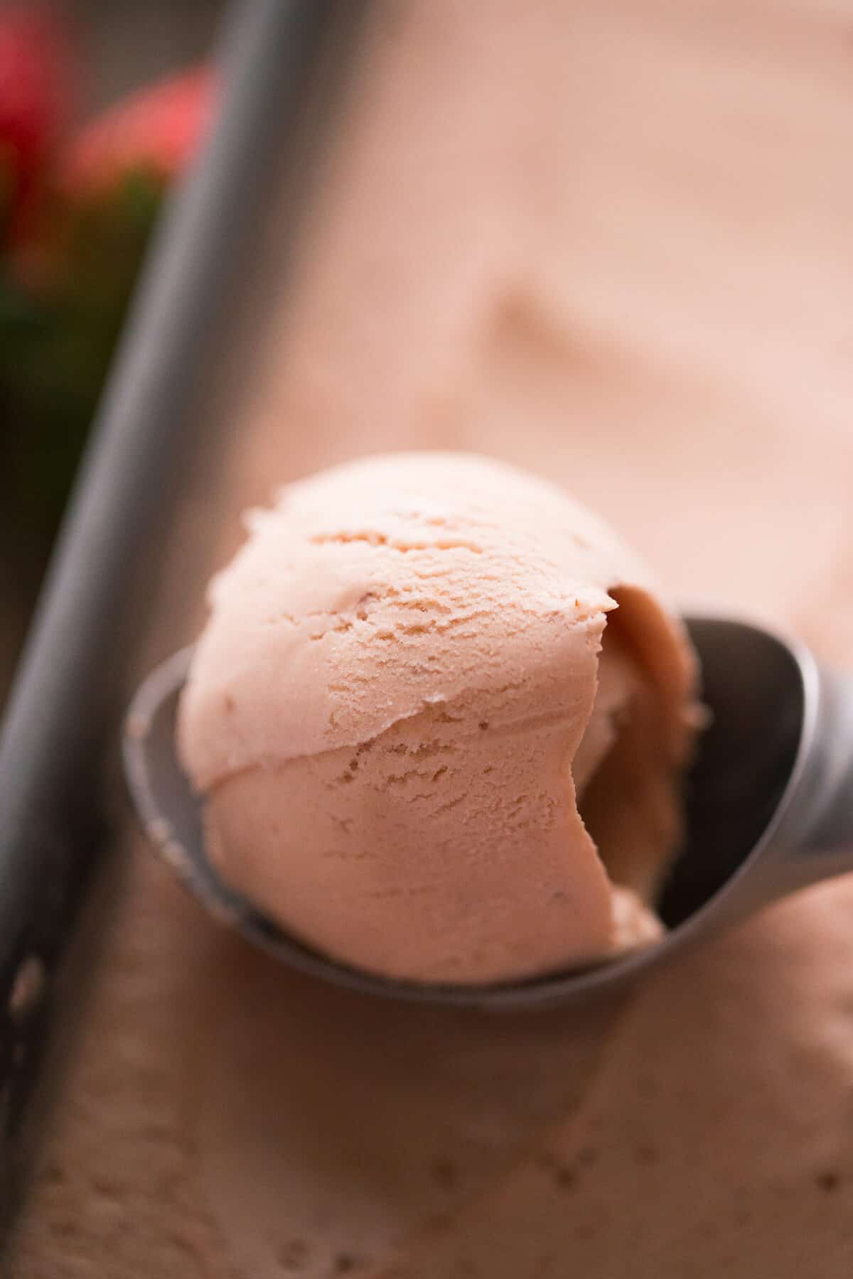 Scooping delicious Brown Sugar Strawberry Ice Cream.