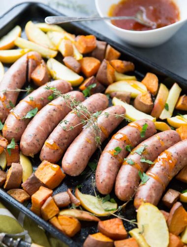 This sheet pan sausage dinner is inspired by the flavors of fall.  Cheesy sausage is baked along side sweet potatoes, apples and a simple apricot glaze!