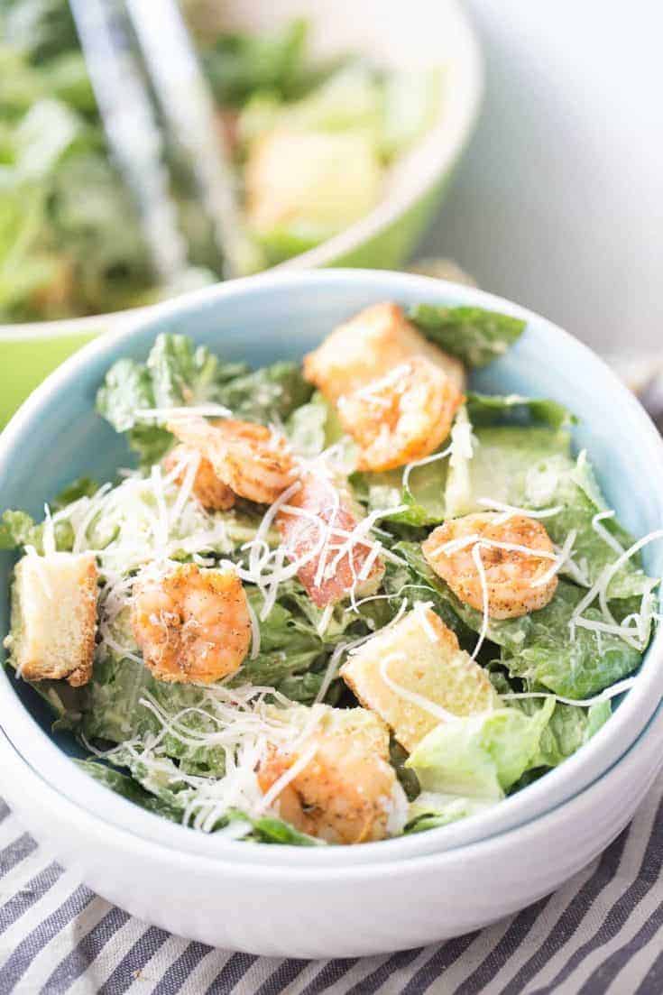 Crisp and cool lettuce is balanced by seasoned, grilled shrimp in this refreshing Shrimp Caesar Salad! Traditional Caesar salad dressing is replaced with an avocado dressing that adds just the right amount of creaminess to each bite!