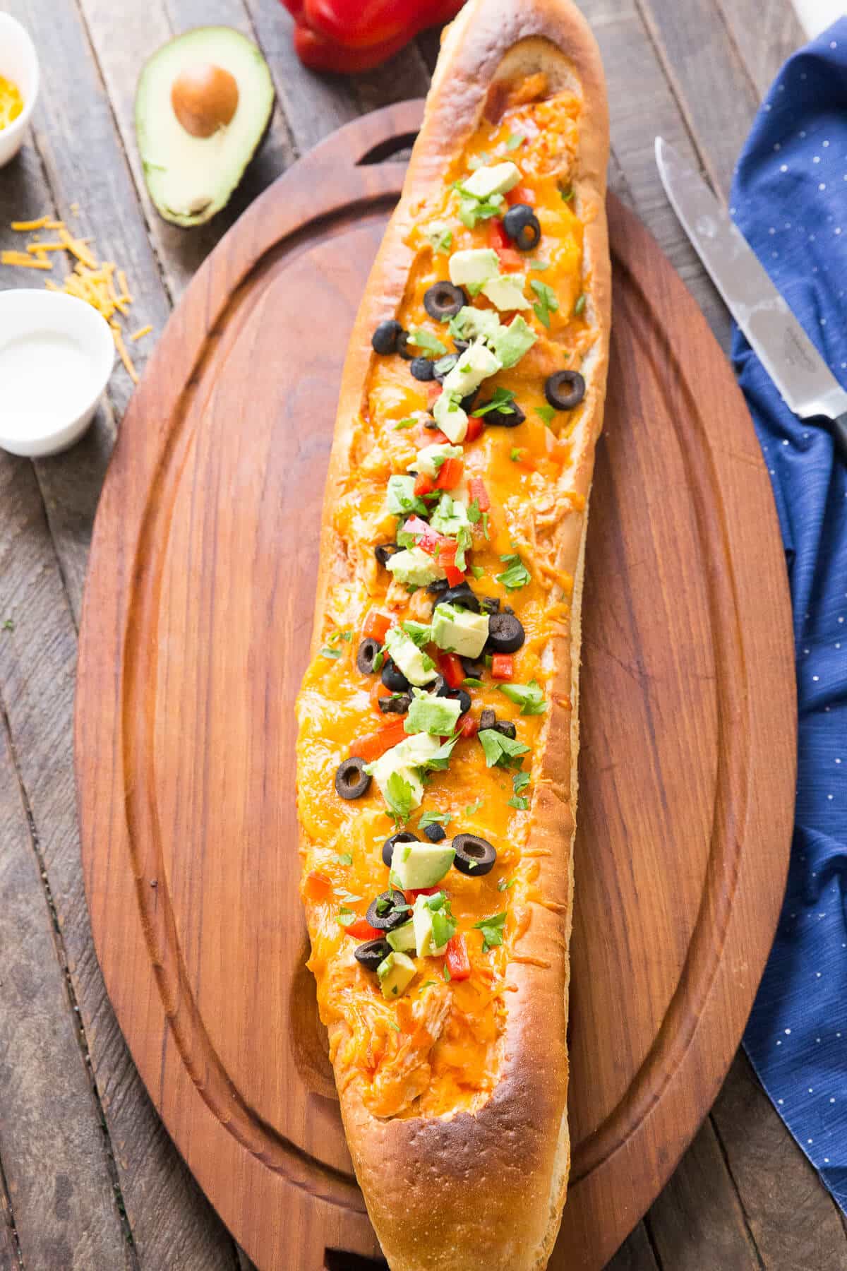 Chicken enchiladas are stuffed inside a loaf of French bread and baked! How simple is that?