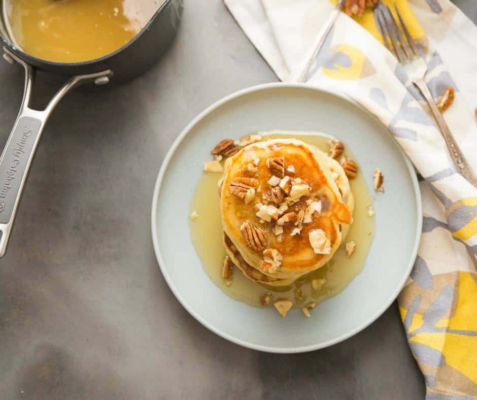 Banana's Foster makes an appearance at your breakfast table instead of the dessert table! Banana pancakes, rum flavored caramel sauce and a nutty topping elevate ordinary pancakes into something extraordinary!