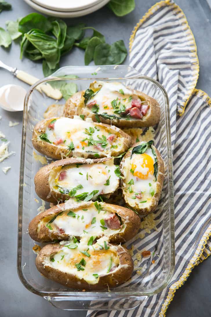 Breakfast baked potatoes are going to make you rethink the whole idea of a baked potato!  These baked spuds are not just side dishes that get topped with bacon and cheese.