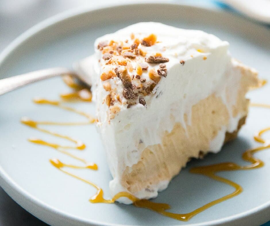 Piece of pumpkin pie on a blue plate