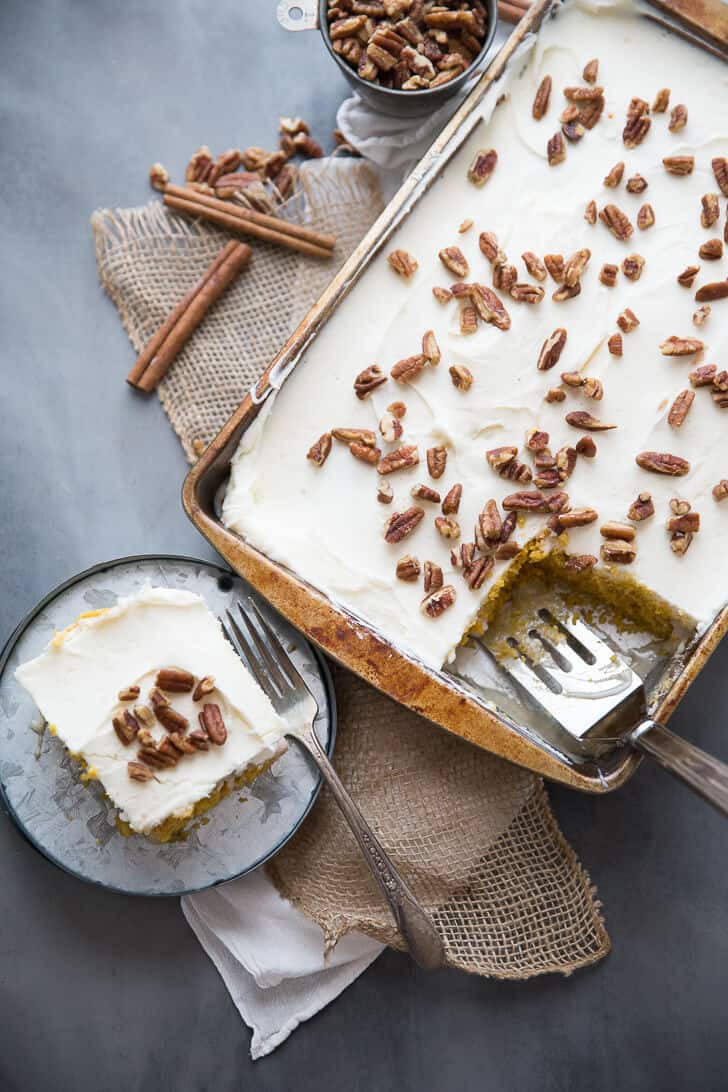 Love a good pumpkin roll but don't want to put in the time?  I have just the solution! This easy poke cake takes everything we love about pumpkin rolls and turns it into an easy to assemble cake!