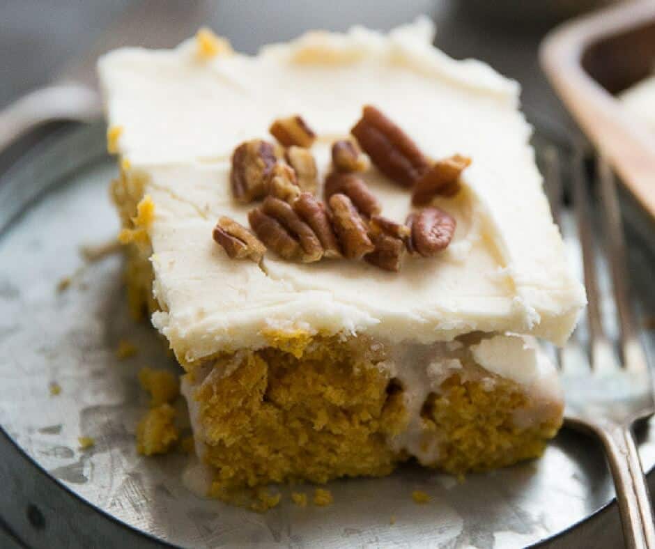 Love a good pumpkin roll but don't want to put in the time?  I have just the solution! This easy poke cake takes everything we love about pumpkin rolls and turns it into an easy to assemble cake!