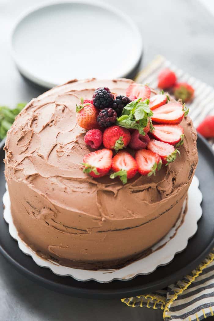 Whole chocolate cake with fruit