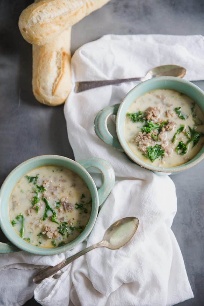 two bowls of sausage and kale soup