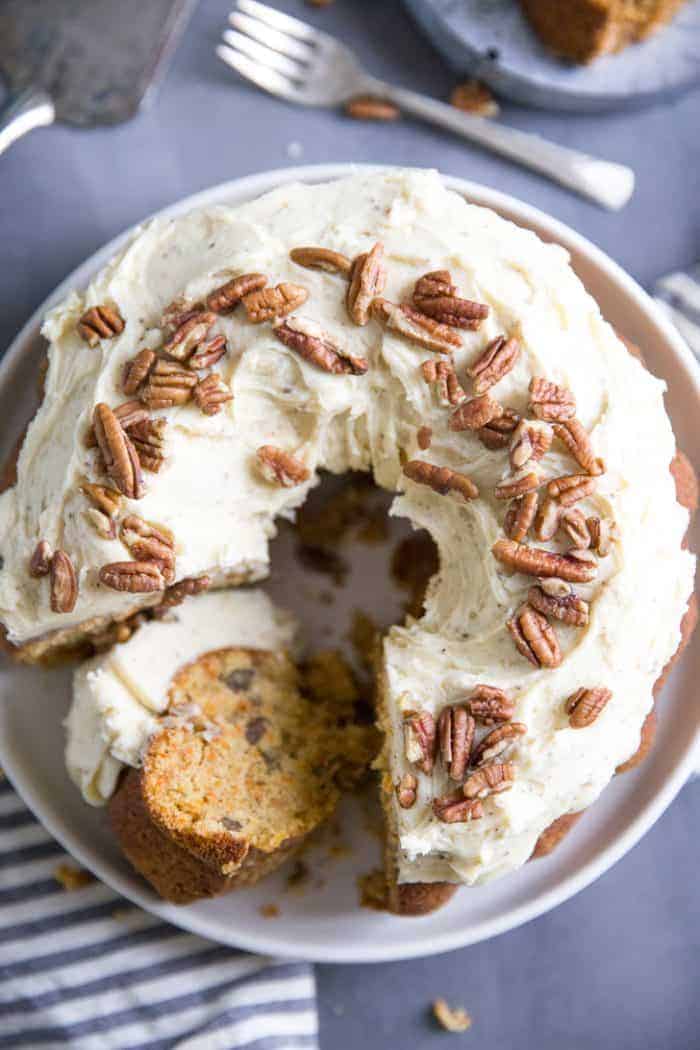 Homemade carrot cake recipe with slice on its side