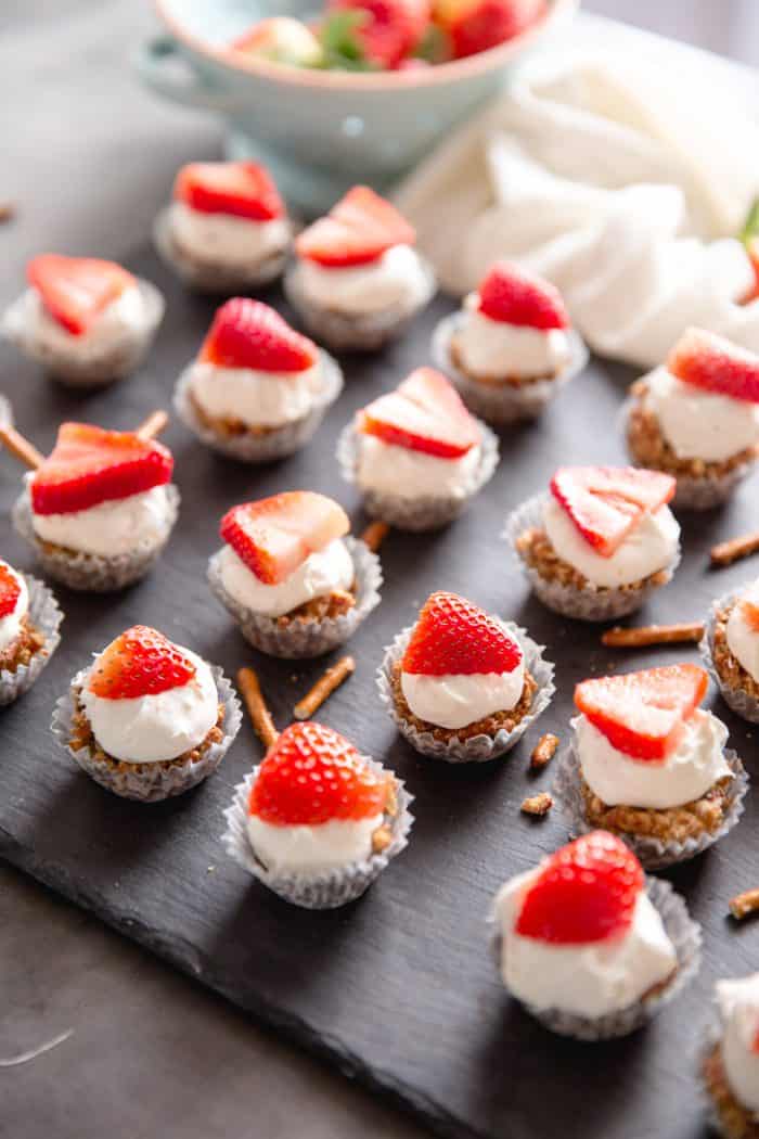 Pretzel Salad bites on black surface