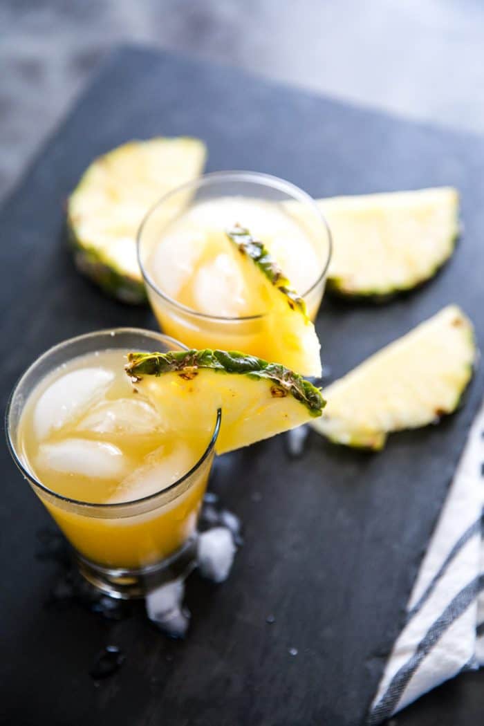 Vodka Cocktail two with pineapple slices surrounding