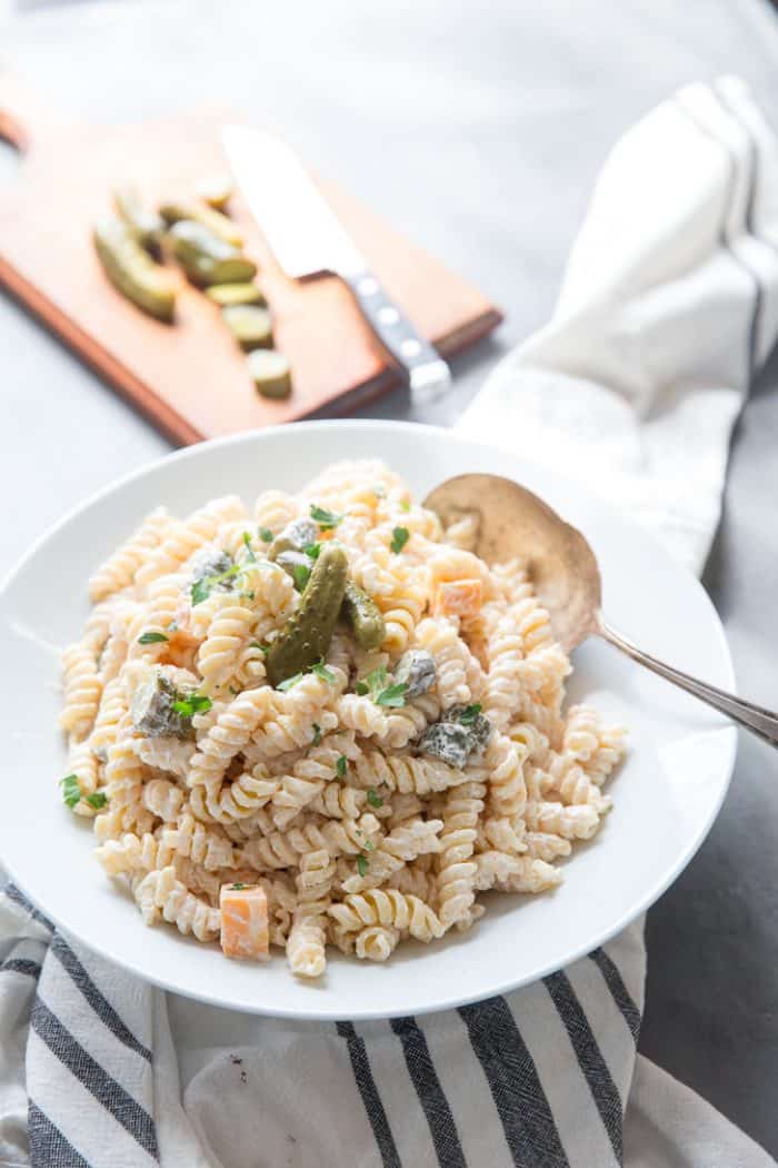 dill pickle pasta salad with serving spoon