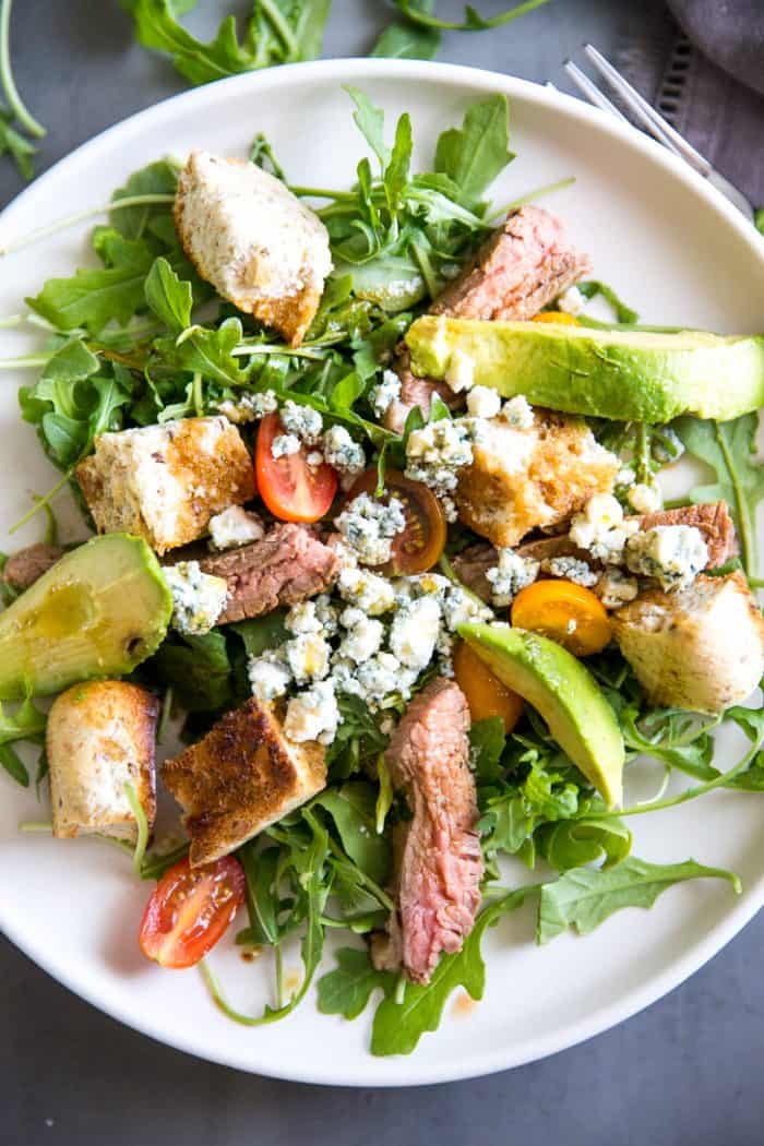 Black and blue steak in a salad