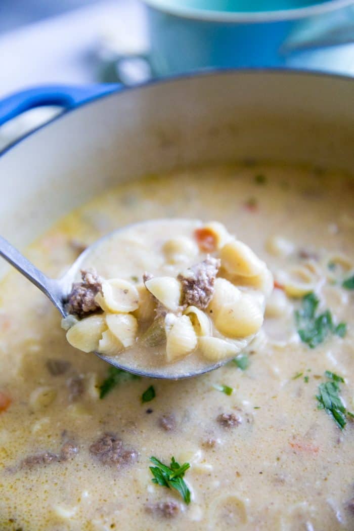 cheeseburger soup with a scoop ladled
