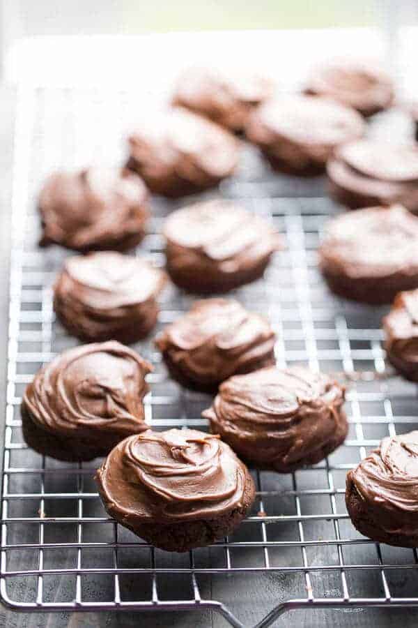 Intensely mocha chocolate chunk cookies with a thick, rich chocolate frosting! Grab a glass of milk and dig in!