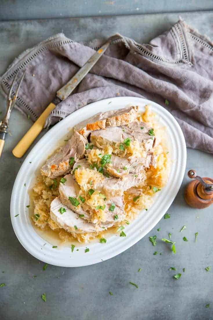 pork and sauerkraut with fork and knife