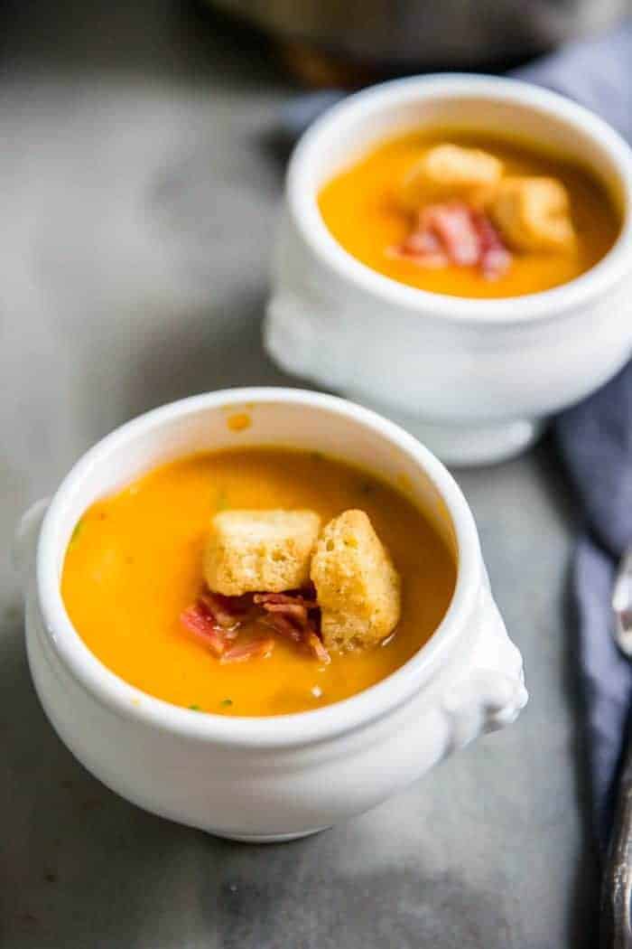 roasted butternut squash soup two white bowls