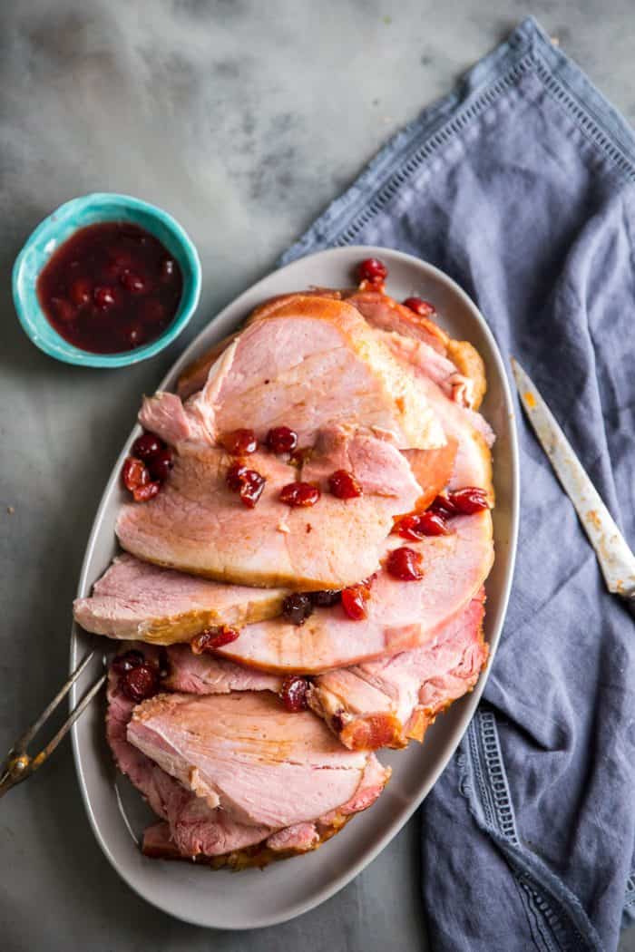 Baked ham with cherries on top
