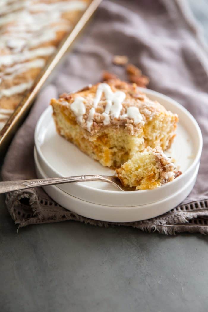 cinnamon coffee cake with a bite on a fork