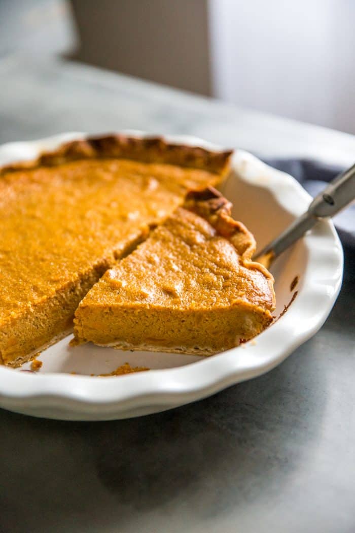 Homemade sweet potato pie half a pie and a piece