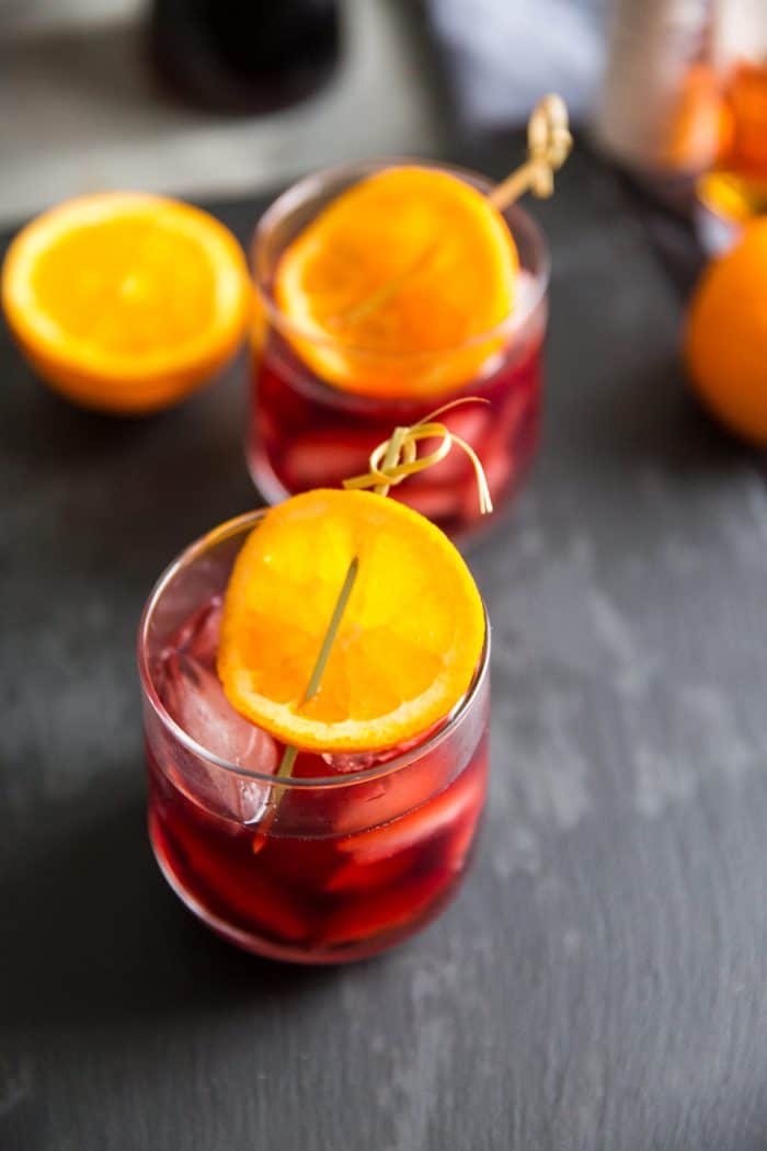 Pomegranate old fashioned with orange slices