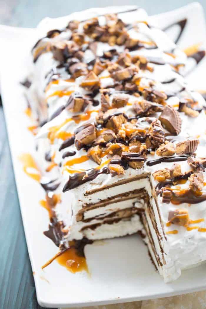 Reese Ice Cream Cake on platter with a slice out