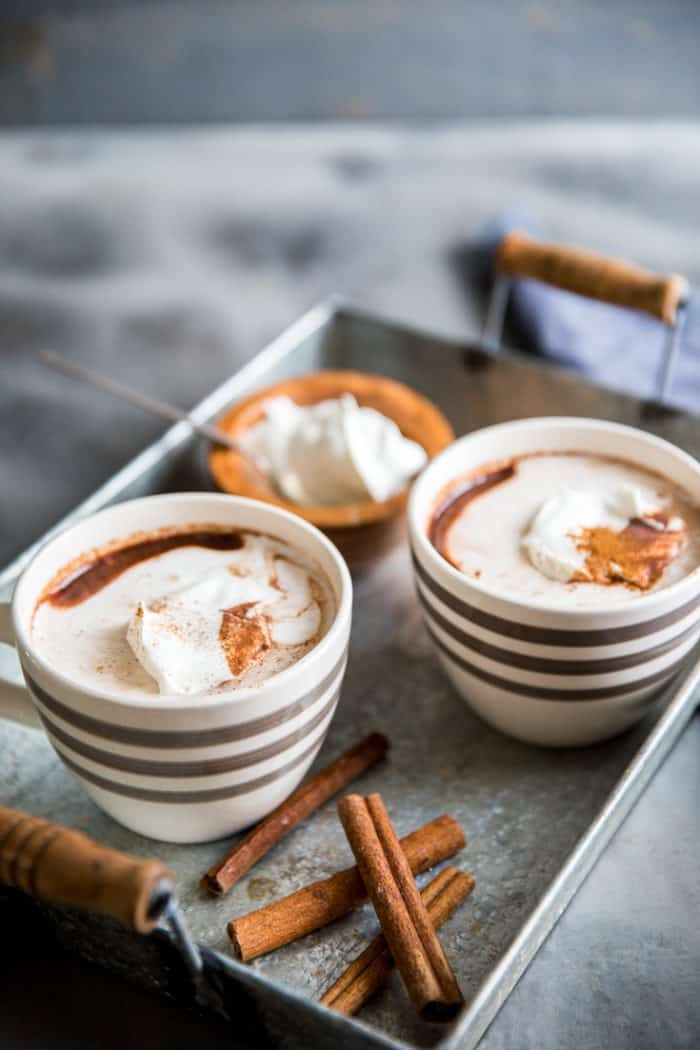 cinnamon hot chocolate two mugs on a tray