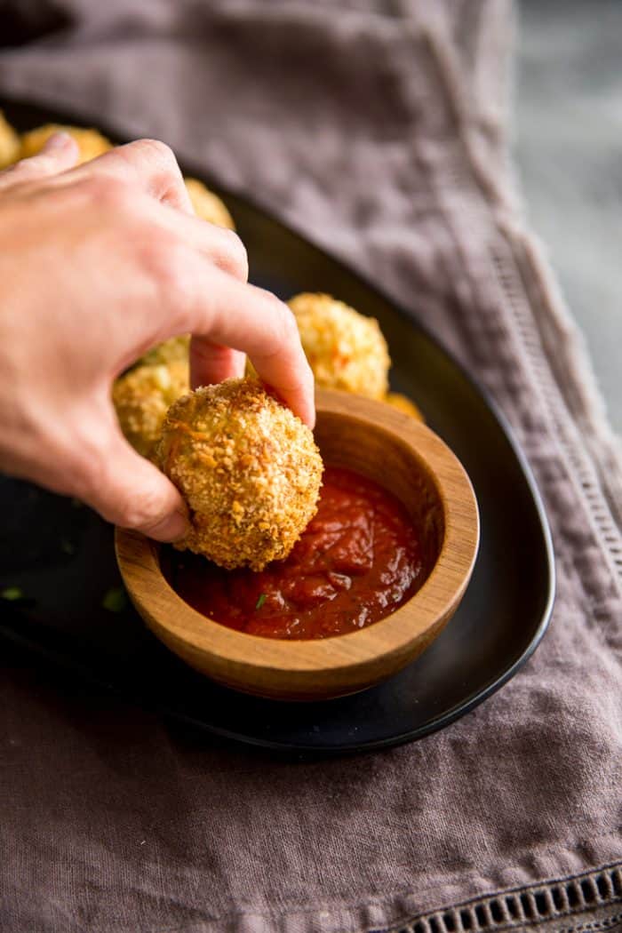 risotto balls dipped in sauce
