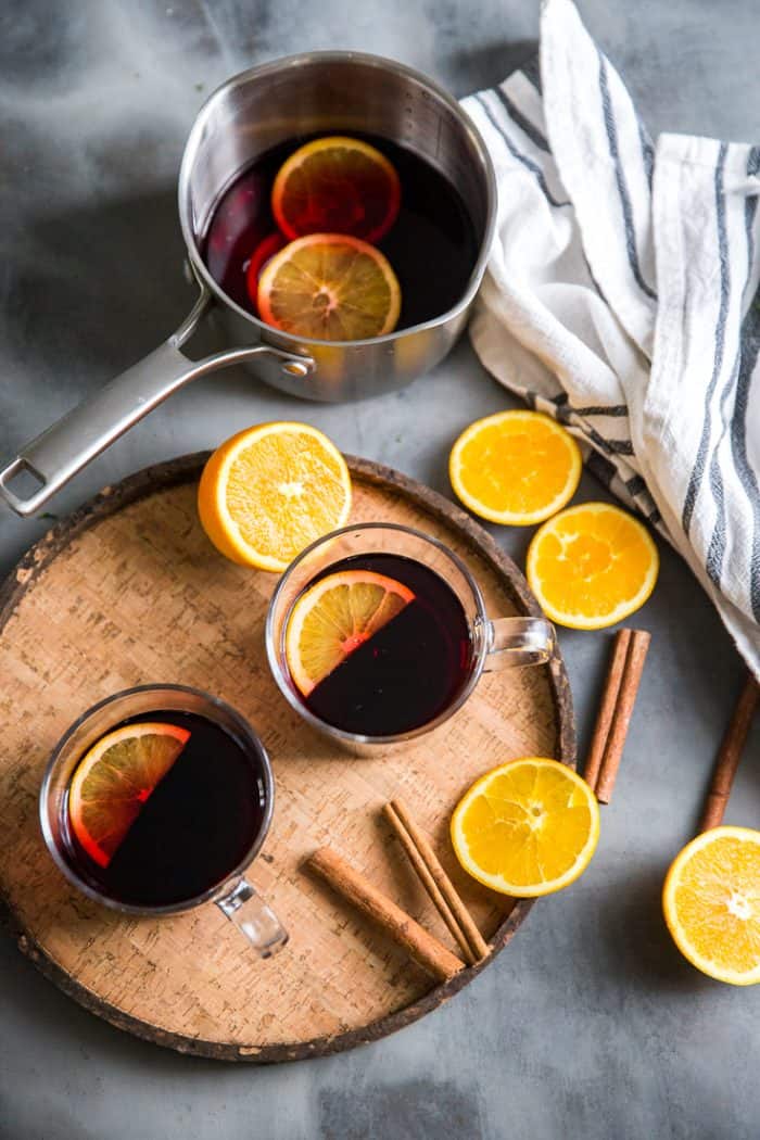 Warm red wine sangria two mugs and orange slices