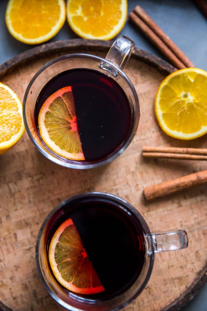 Warm red wine sangria two glasses with an orange slice