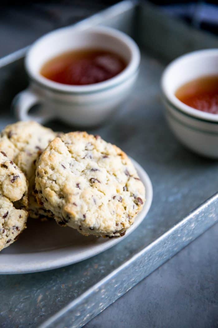 chocolate chip scone with two cups of tea