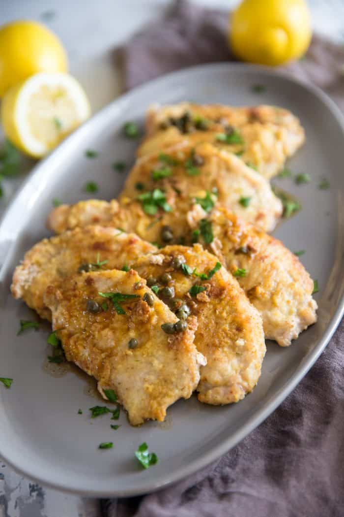 pork cutlets with lemons and parsley