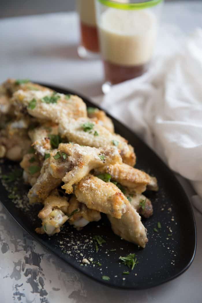 Garlic Parmesan dry rub chicken wings gray background