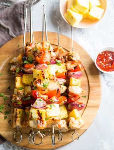 Pineapple Chicken Kabobs on a brown tray