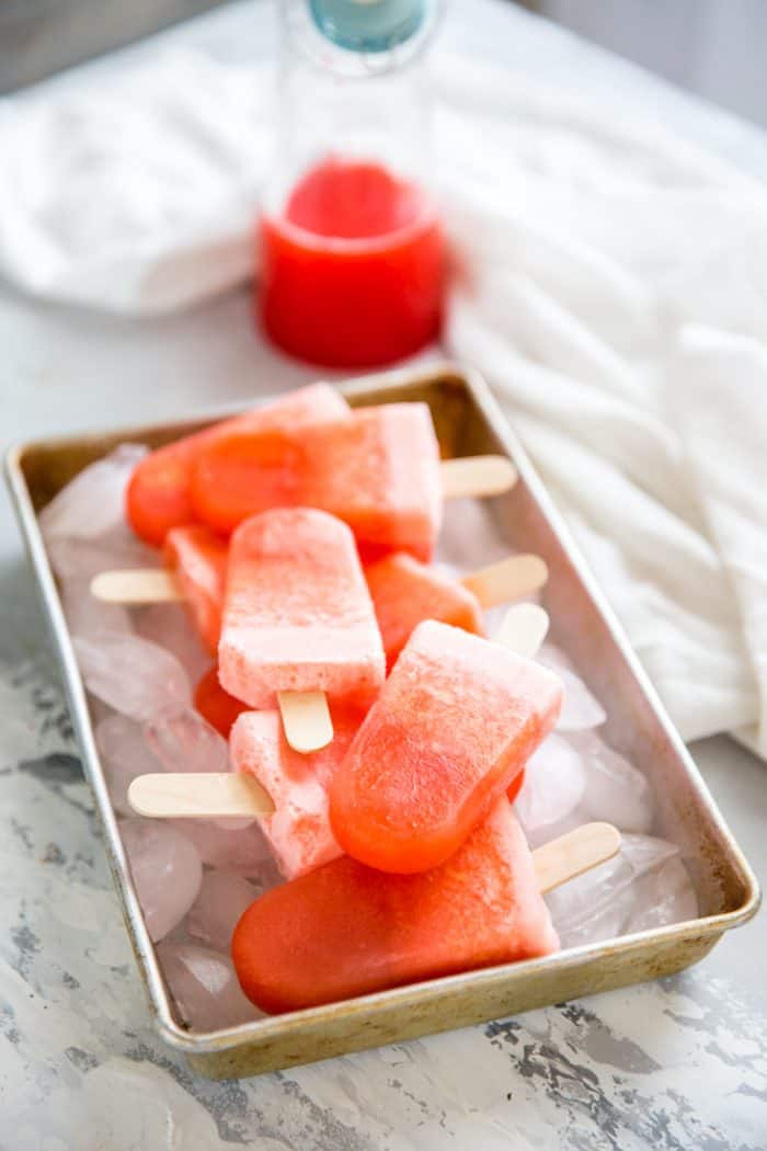 rum punch popsicles on a tray