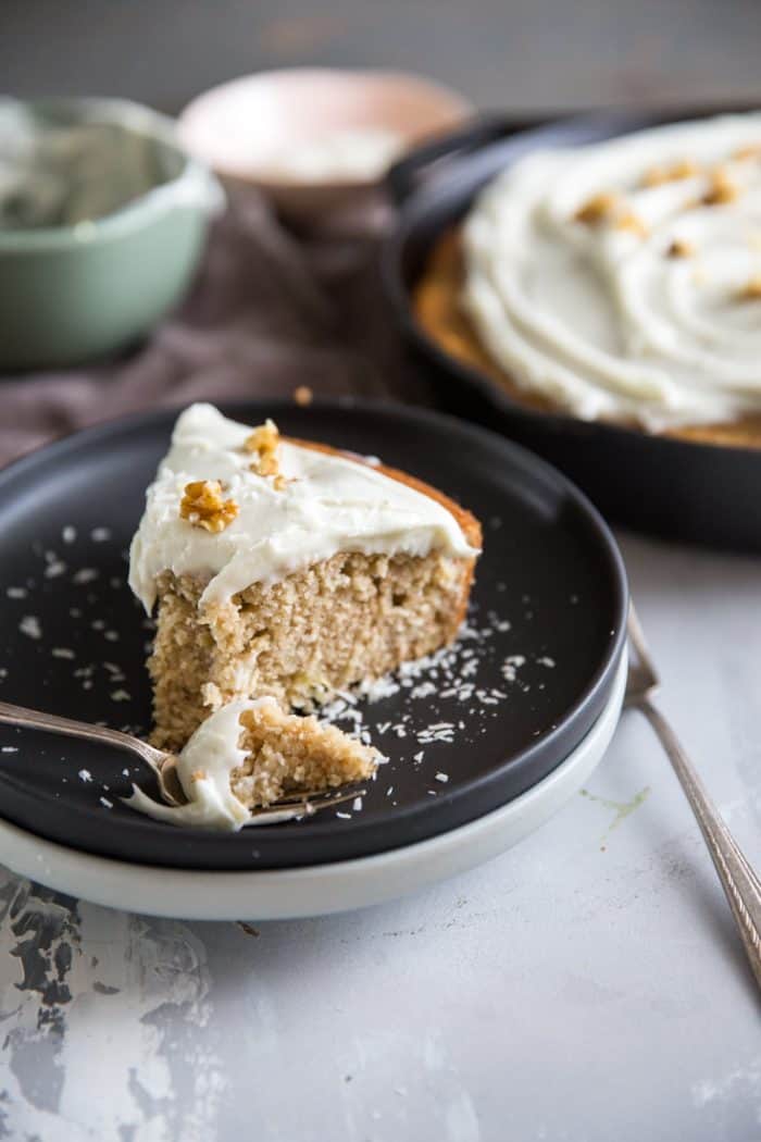 Hummingbird cake slice on a black plate